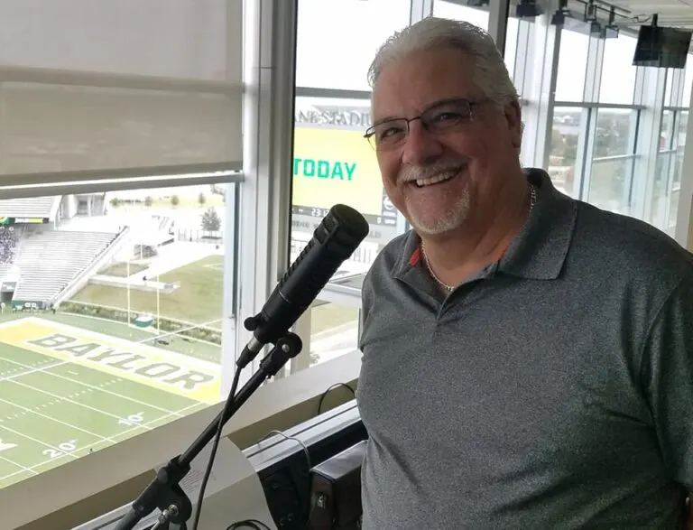 Terry Hunt, Executive Director of Community Cancer Association, at the Baylor Stadium broadcasting booth